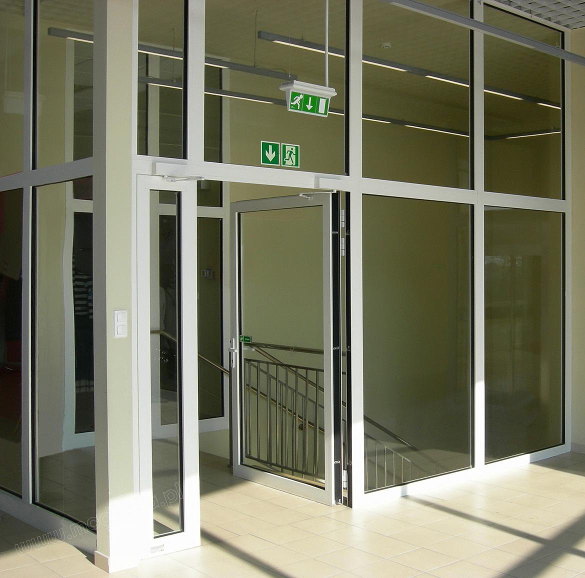 Aluminium fire doors EI30 in a glazed wall EI60.