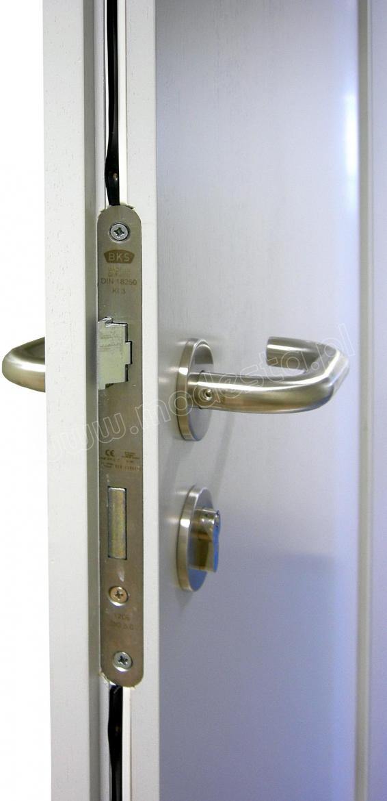 The EI30 wooden fire and smoke resistant door leaf with lock, hardware and seals. Stainless steel safety door handle on a rose with stainless steel escutcheon and cylinder lock.